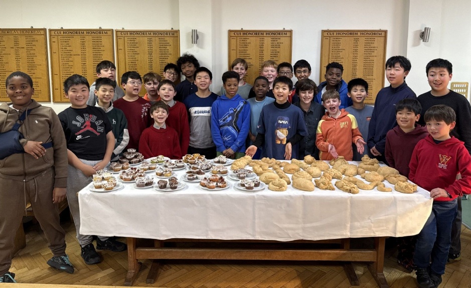 Group of boarders displaying their baking results